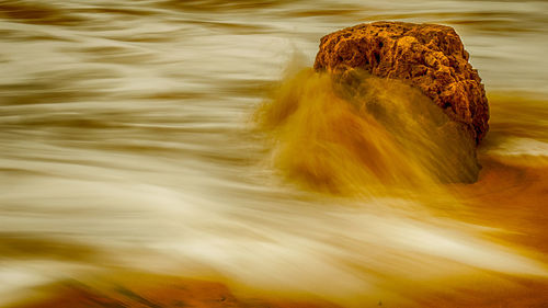 Blurred motion of rocks at sea shore