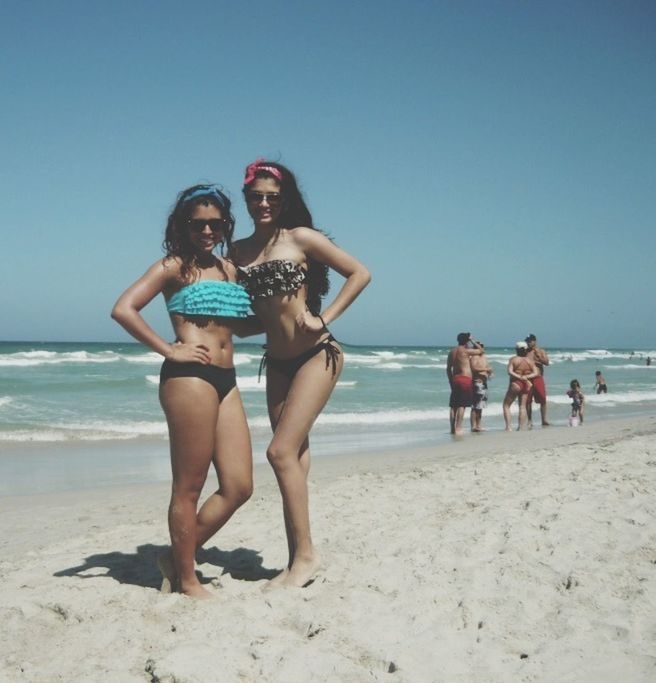 beach, sea, lifestyles, leisure activity, vacations, water, sand, togetherness, shore, horizon over water, full length, young adult, young women, person, bonding, clear sky, love, enjoyment