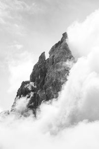 Low angle view of rock formation against sky