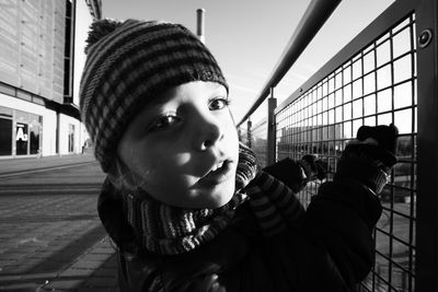 Close-up portrait of young woman in city