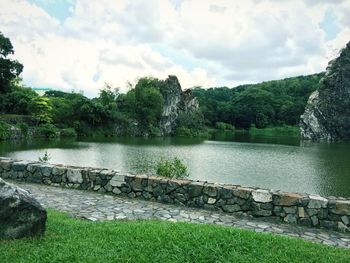 View of lake against cloudy sky