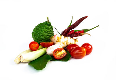 Close-up of chopped fruits against white background