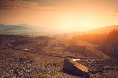 Scenic view of landscape against sky during sunset