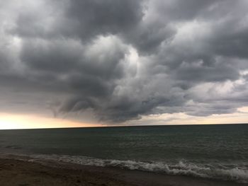 Scenic view of sea against cloudy sky