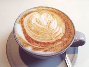 High angle view of cappuccino on table