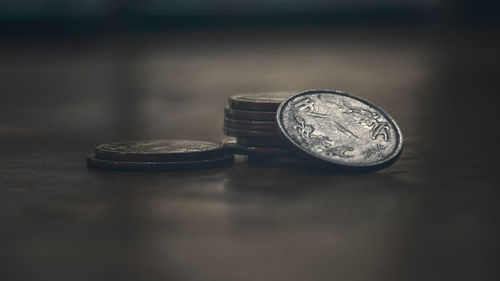 Close-up of coins on table