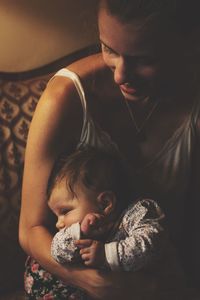 Mother and daughter on sofa