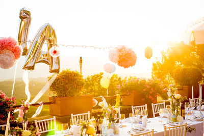 Close-up of flowers on table against clear sky