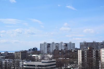 High angle view of buildings in city against sky