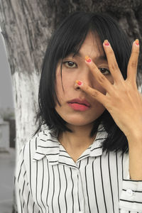 Portrait of young woman gesturing