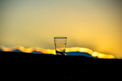 Close-up of beer at sunset