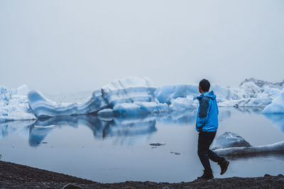 Full length of man walking on mountain during winter