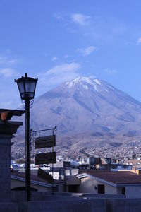 View of mountain range against blue sky