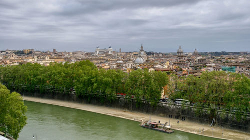High angle view of river amidst buildings in city