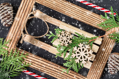 High angle view of christmas decorations on wooden floor