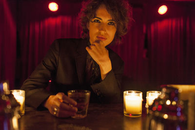 Woman enjoying a drink at a bar