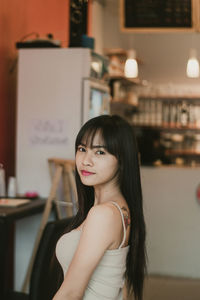 Portrait of smiling woman at store