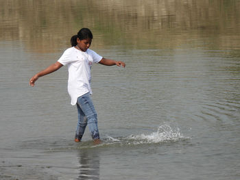 Girl enjoying in the river water