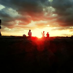 Scenic view of landscape against cloudy sky
