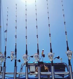 Low angle view of cranes against sky