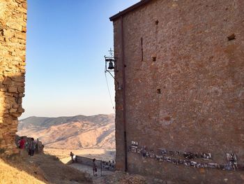 Scenic view of historic site against mountains