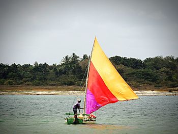Red flag against sky