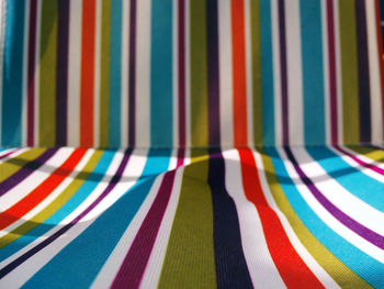 Full frame shot of colorful striped deck chair