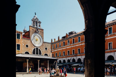 Tourists in front of building