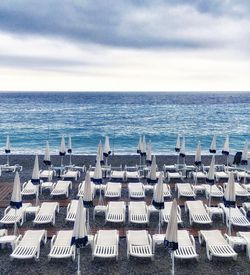 High angle view of sun loungers on beach