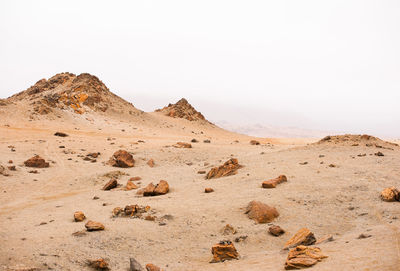 Scenic view of desert against clear sky