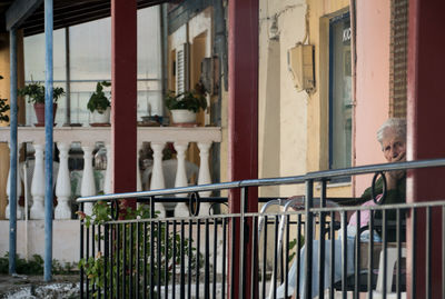 People standing by railing in building