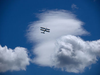 Low angle view of airplane flying in sky