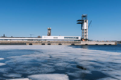 Tower against clear blue sky during winter