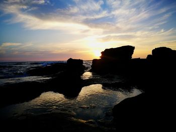 Scenic view of sea against sky during sunset