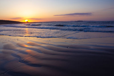 Scenic view of sea against sky during sunset