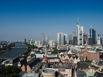 Cityscape against clear blue sky