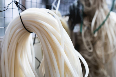 Rolls of rubber and silicone seals hang in the warehouse. ingredients for production