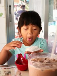 Portrait of girl holding ice cream