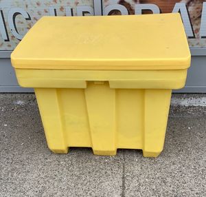 Close-up of yellow can on footpath