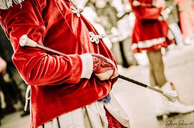 Close-up of woman holding umbrella on street
