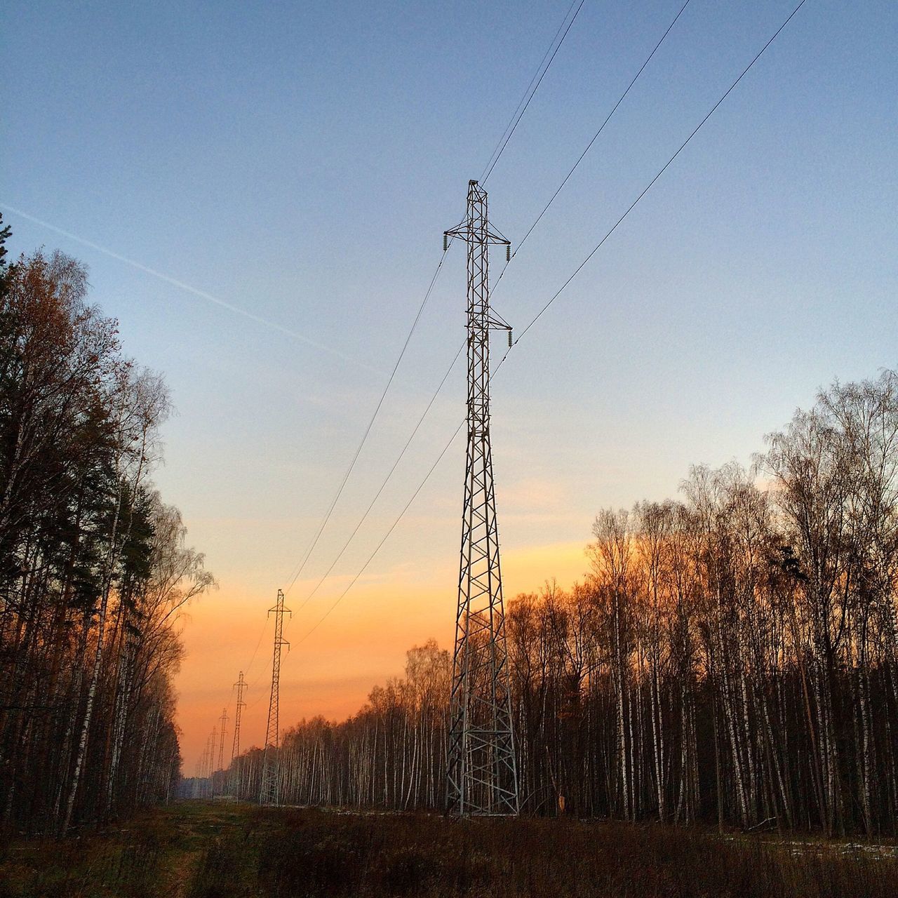 electricity pylon, power line, sunset, silhouette, electricity, power supply, fuel and power generation, tree, connection, tranquility, landscape, clear sky, tranquil scene, cable, field, sky, nature, scenics, technology, beauty in nature