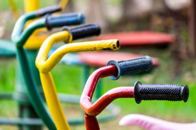 Children's bicycles 3 seats in the playground, front focus, blurred background