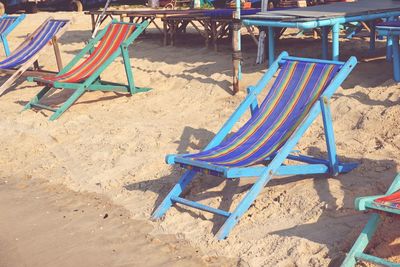 Empty chairs on beach