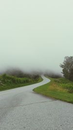 Road passing through field