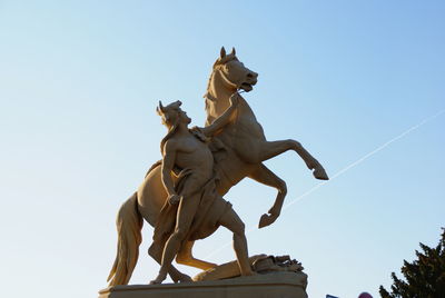 Low angle view of statue against sky