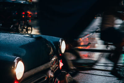 Close-up of wet car on street