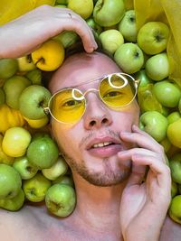 Full frame shot of young man with fruits