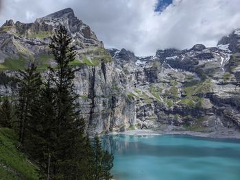 Scenic view of lake and mountains against sky