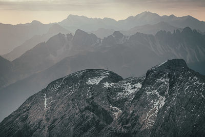 Aerial view of mountain range against sky