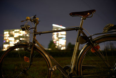 Close-up of bicycle parked on street against sky
